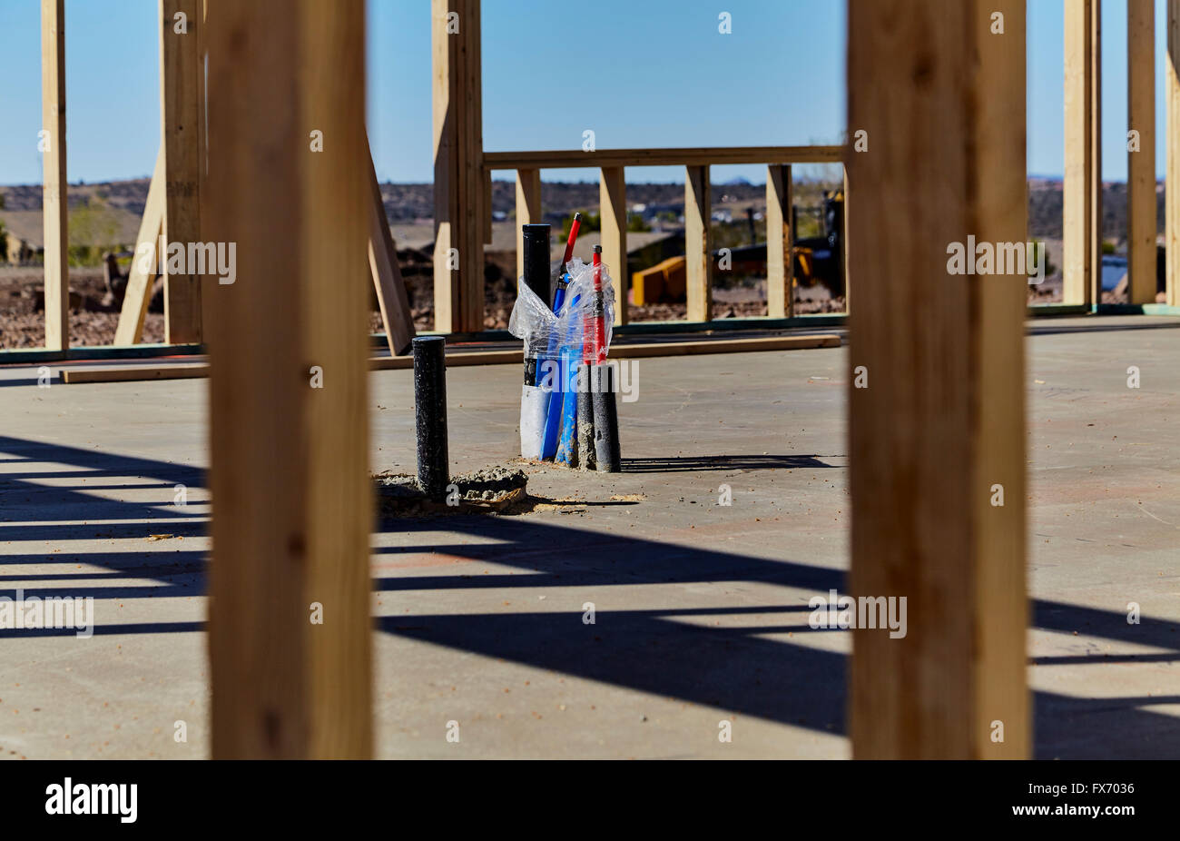 Drain line, vent and water lines in cement foundation of new home construction Stock Photo Alamy