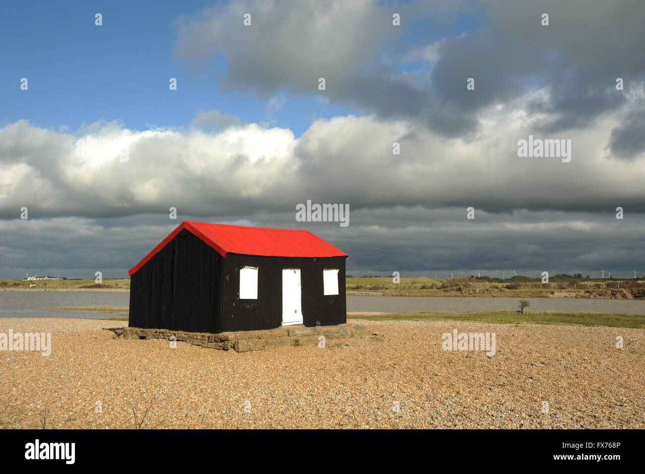 Fisherman S Cottage At Rye Harbour With Blue Sky And Clouds Stock