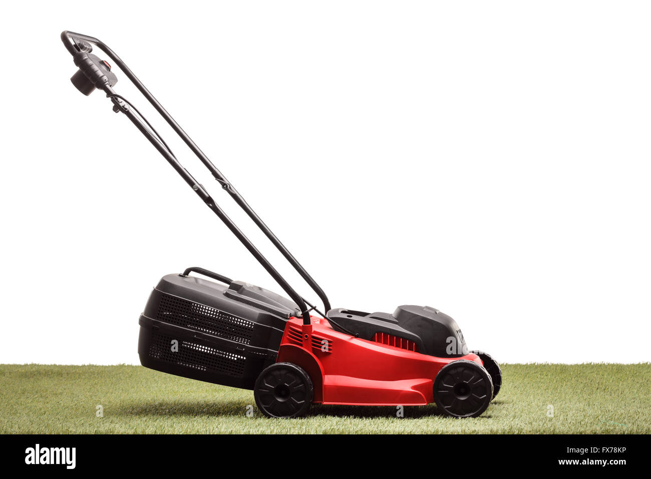 Lawn mower on grass isolated on white background Stock Photo