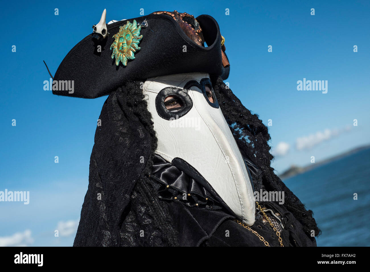 A masked guiser wears a tricorn hat. Stock Photo