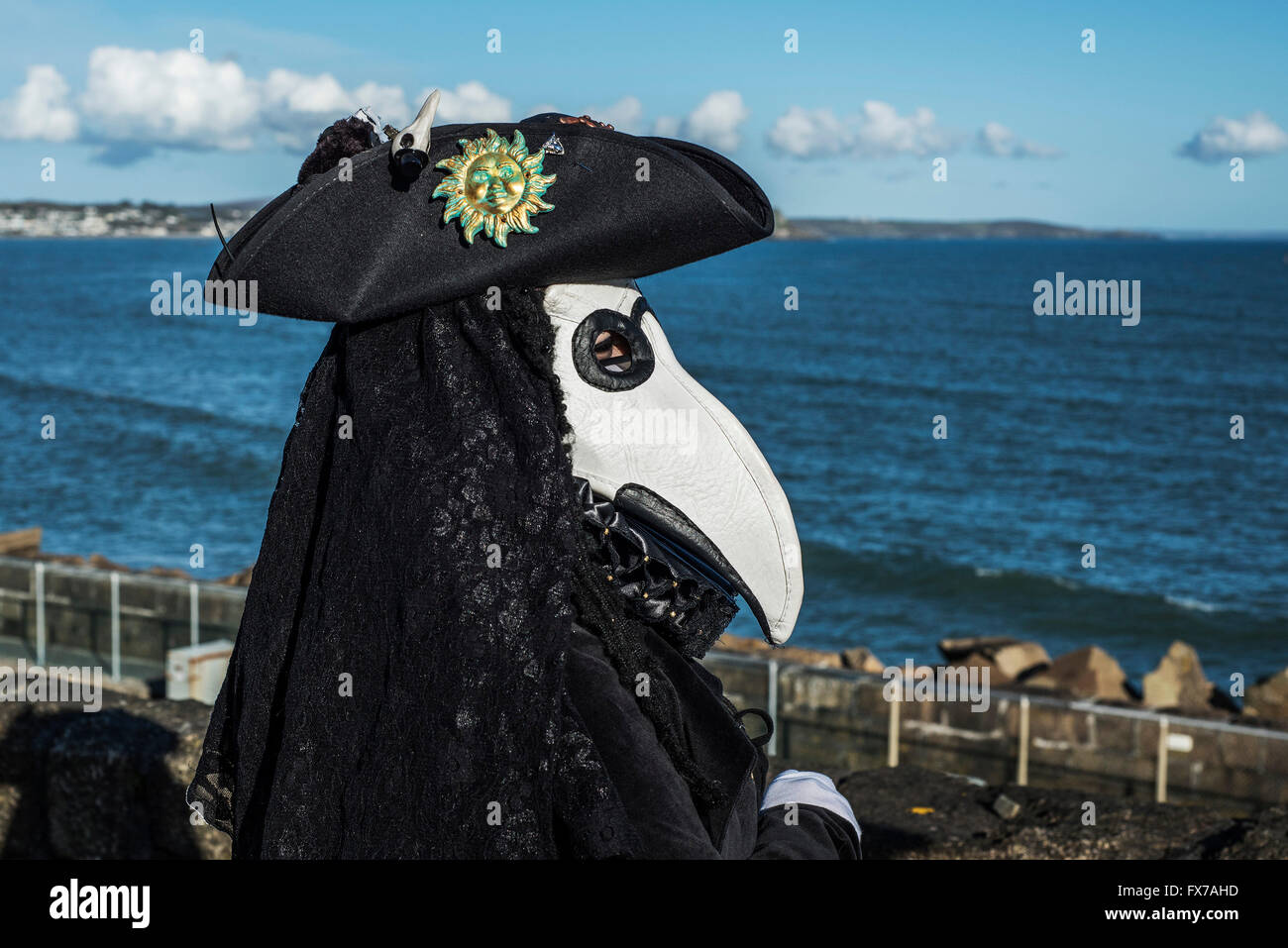 A masked guiser wear a tricorn hat. Stock Photo