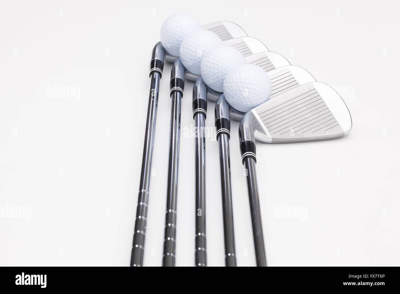 Titanium golf clubs on the white background Stock Photo Alamy