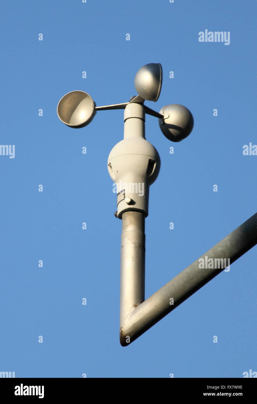 Anemometer on blue sky background Stock Photo