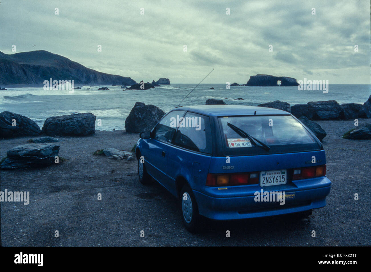 Archive image of a metallic blue 1990 model Geo Metro 3-door subcompact hatchback car, Big Sur, California USA, 1990 Stock Photo