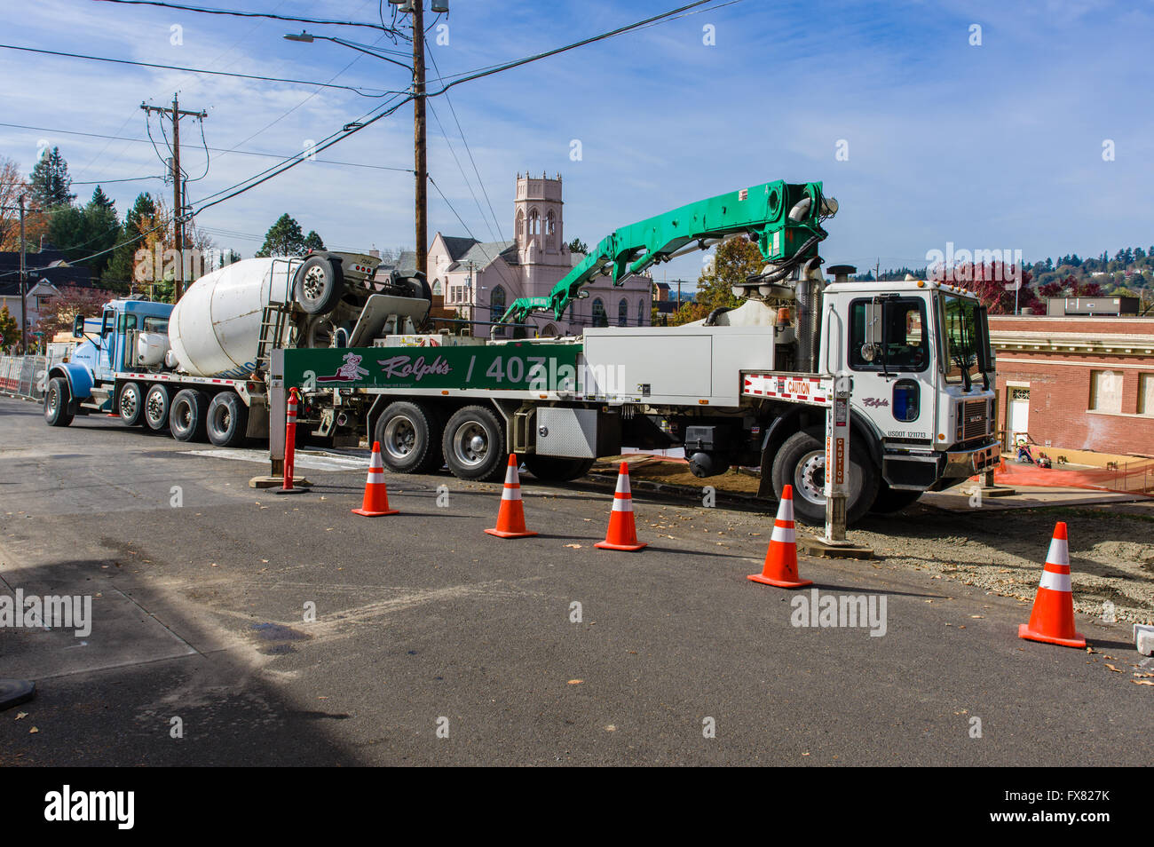 Construction workers pour concrete at the site of the expanded Oregon