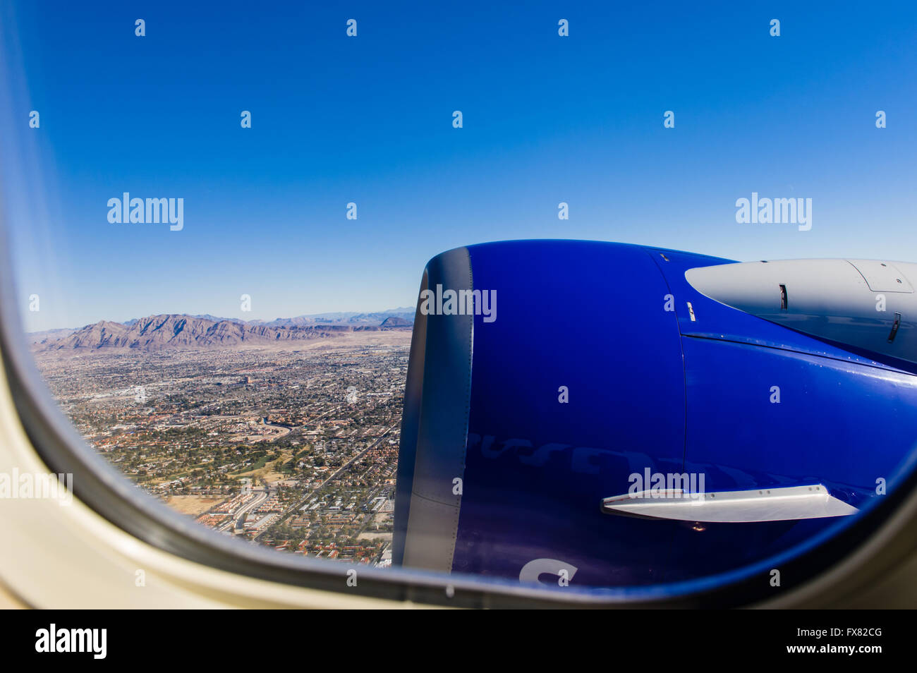 Aerial view showing window and aircraft engine over Las Vegas Nevada