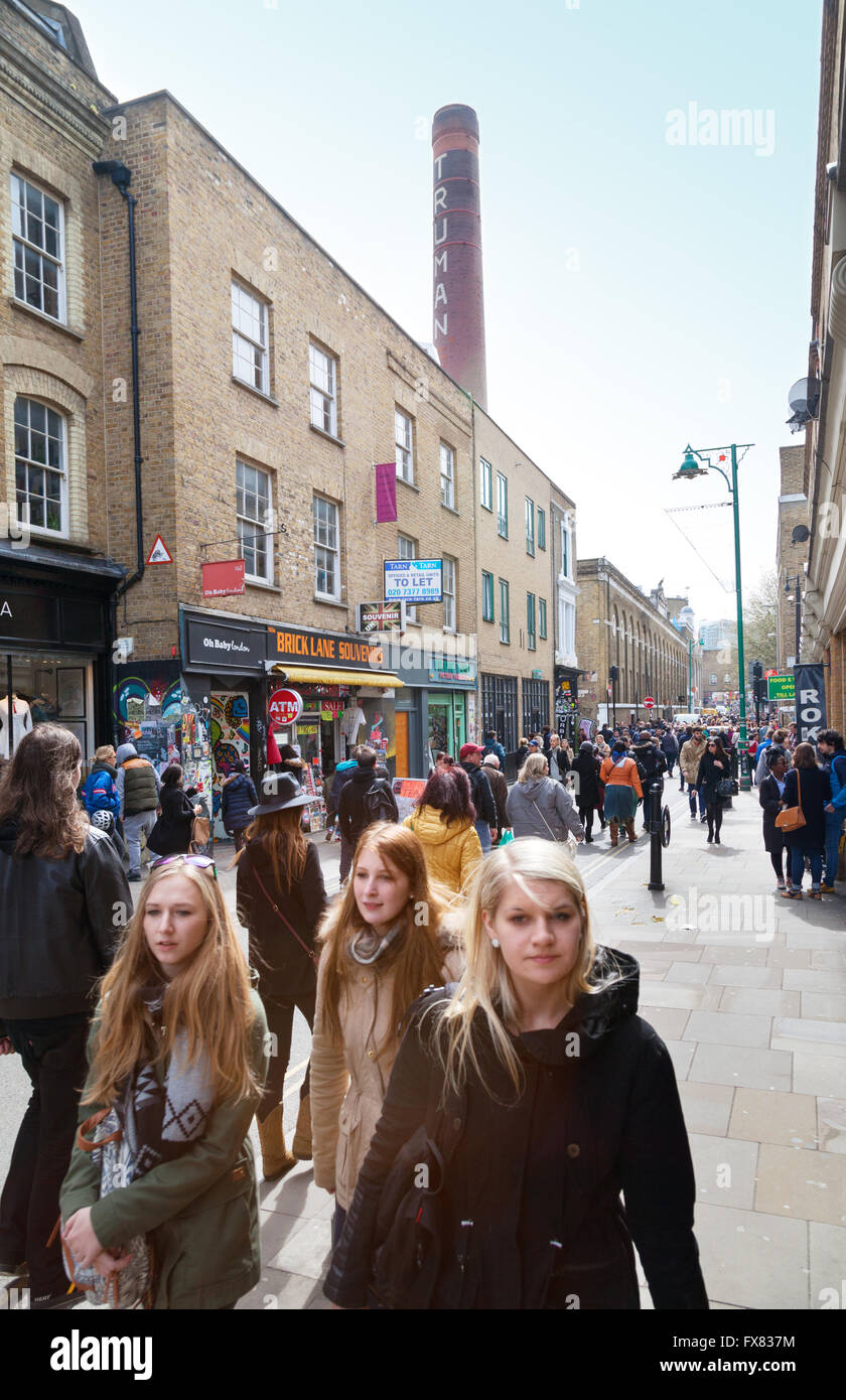 People walking, Brick Lane, London East End, London E1, UK Stock Photo