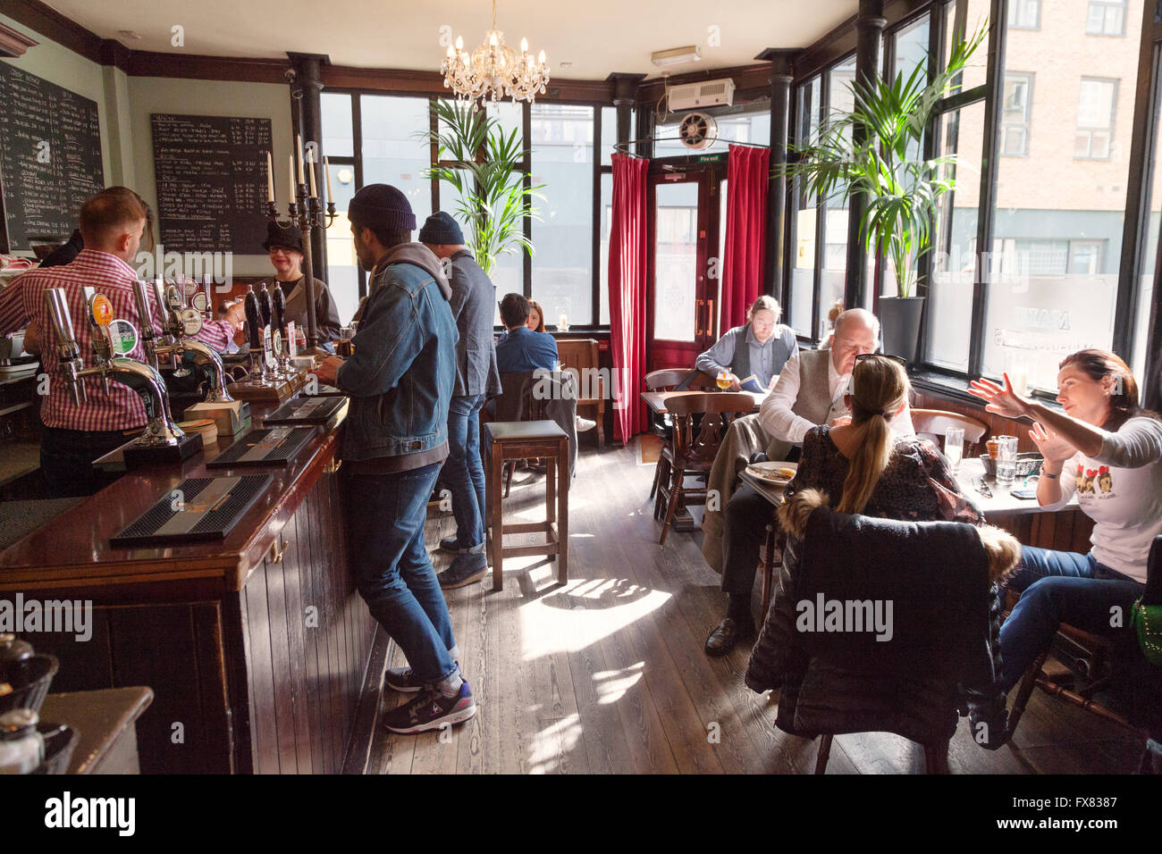 London Pub; People drinking in the Carpenters Arms pub, Cheshire Street
