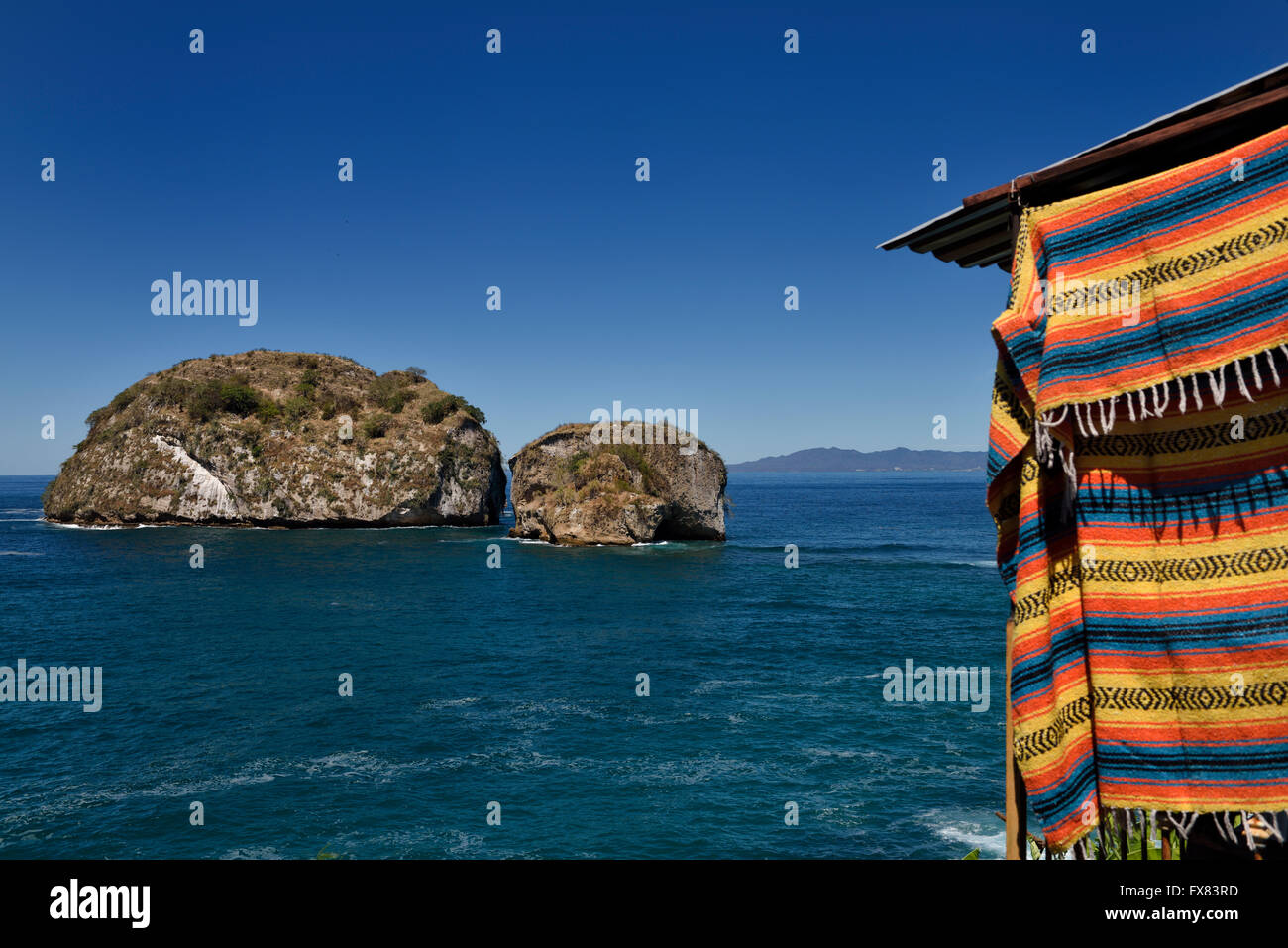 Los Arcos National Park Puerto Vallarta Mexico with locally made blanket on gift stall Stock Photo