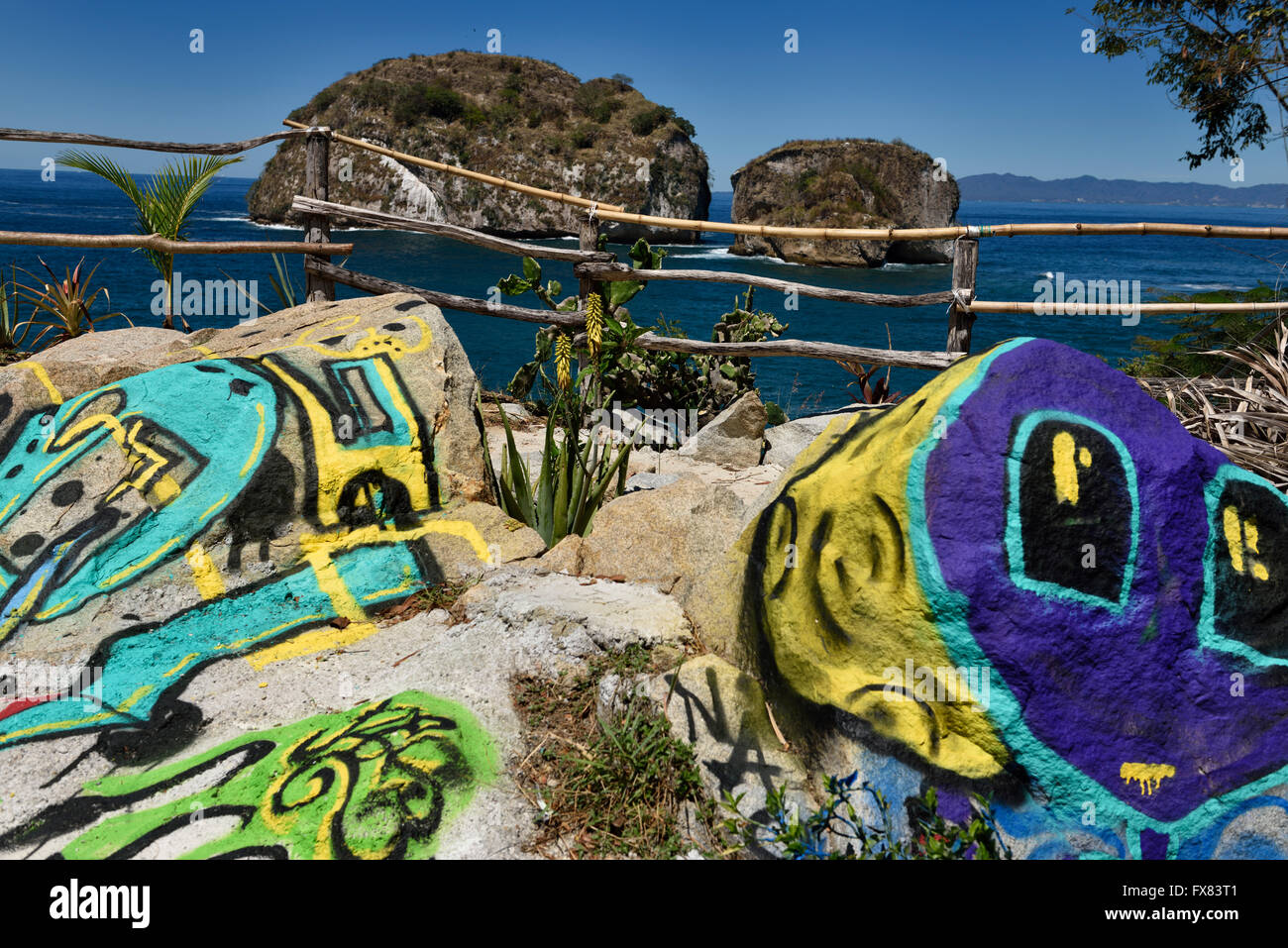 Colorful graffiti on rocks at Los Arcos National Park Puerto Vallarta Mexico Stock Photo