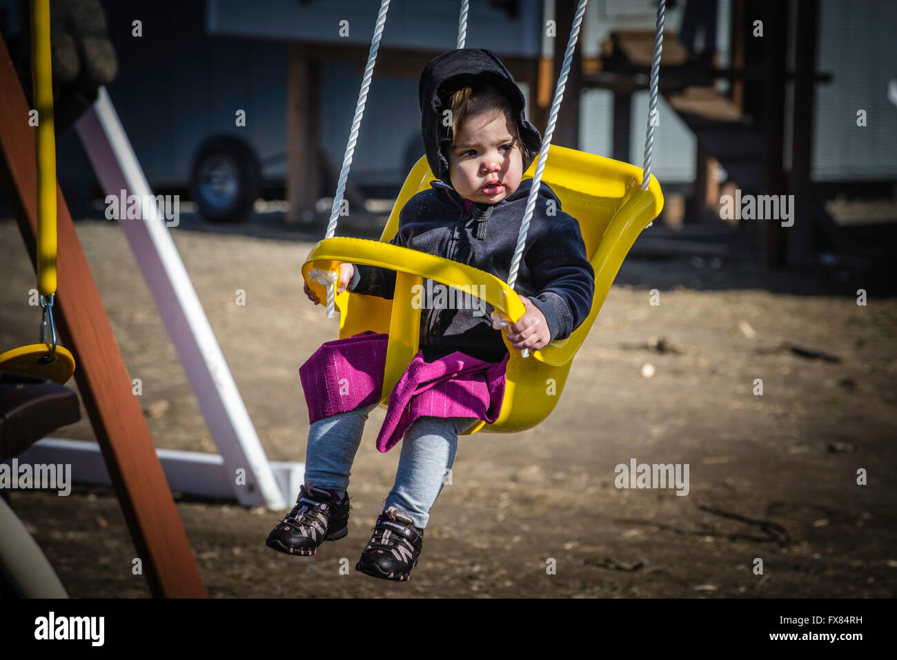 Amish Girl On Swing High Resolution Stock Photography and Images - Alamy