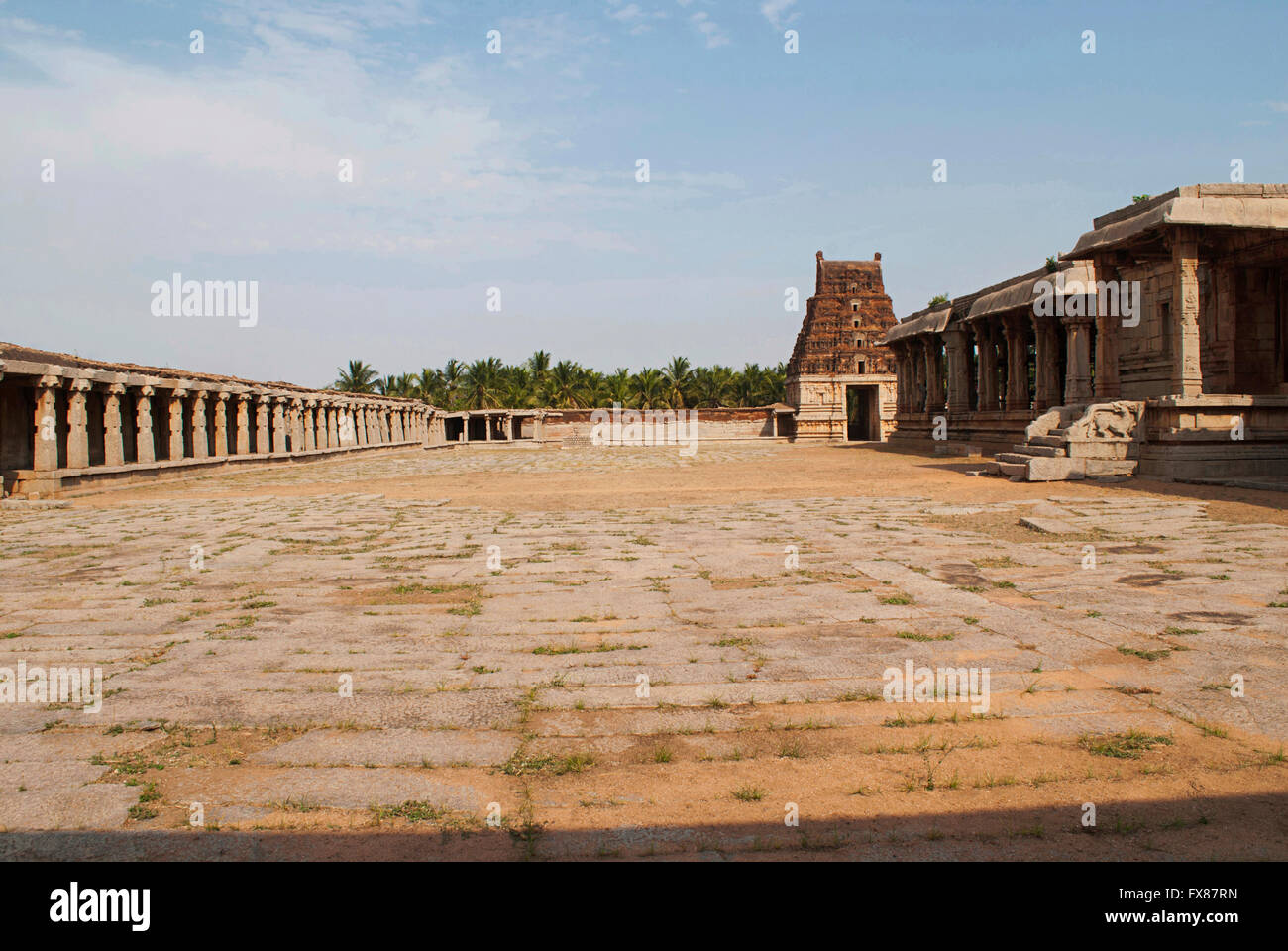 The prakara on the left, east gopura and the side (north) entrance to the ardha-mandapa, Pattabhirama Temple, Hampi, Karnataka,  Stock Photo