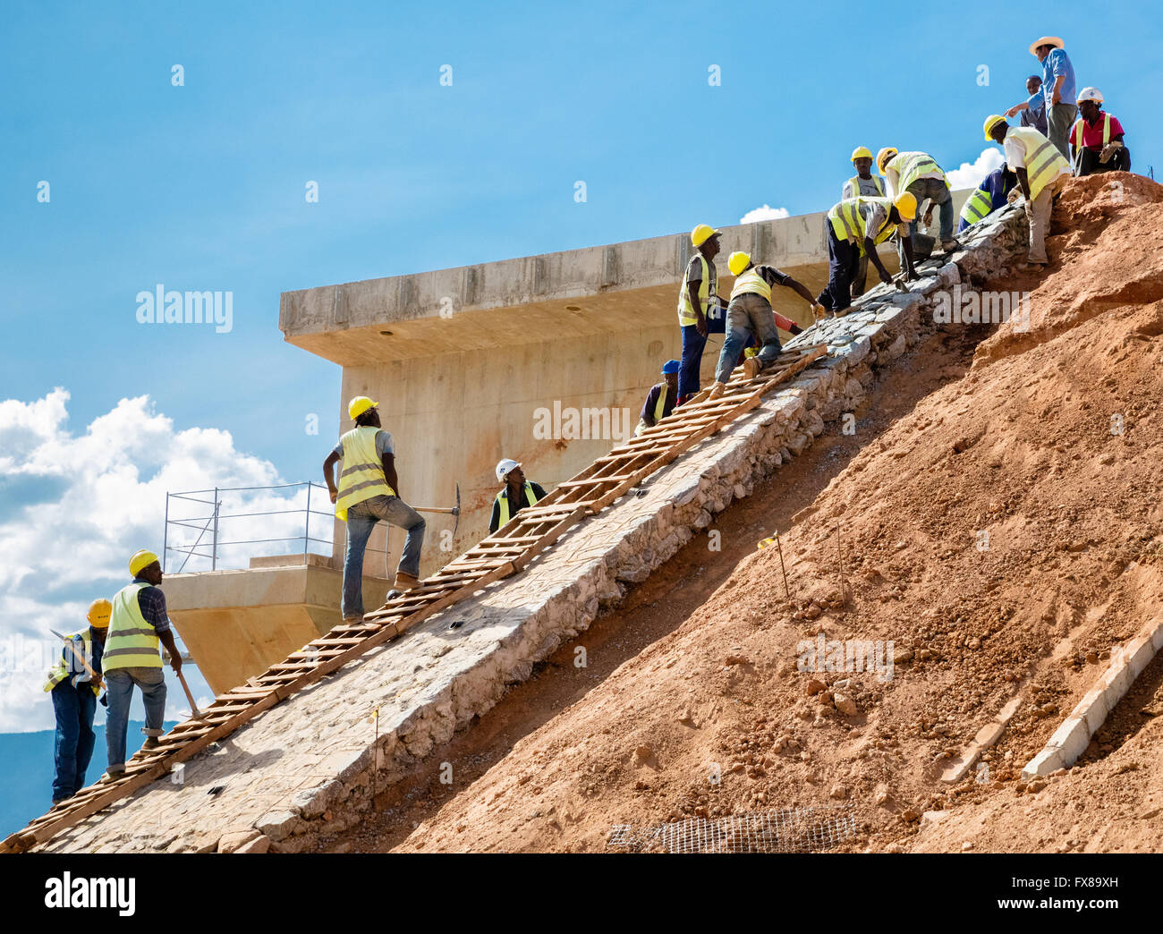 Men working on the embankments of the Nairobi to Mombasa section of the China funded Standard Gauge Railway Project in Kenya Stock Photo