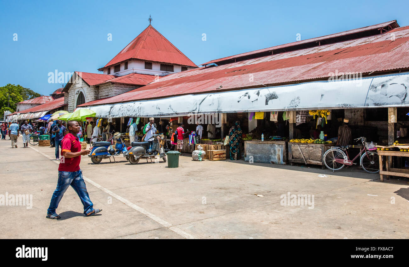 Facade of colourful ad bustling Darajani Market in Stone Town Zanzibar in Tanzania East Africa Stock Photo