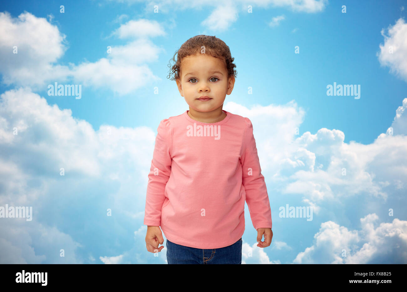 beautiful little baby girl portrait over blue sky Stock Photo - Alamy