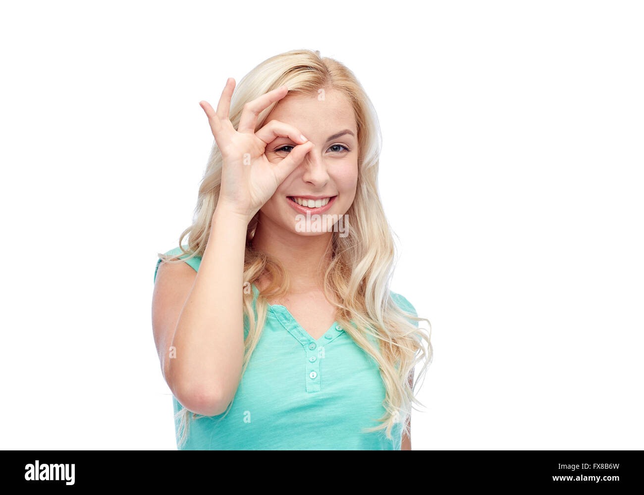 young woman making ok hand gesture Stock Photo