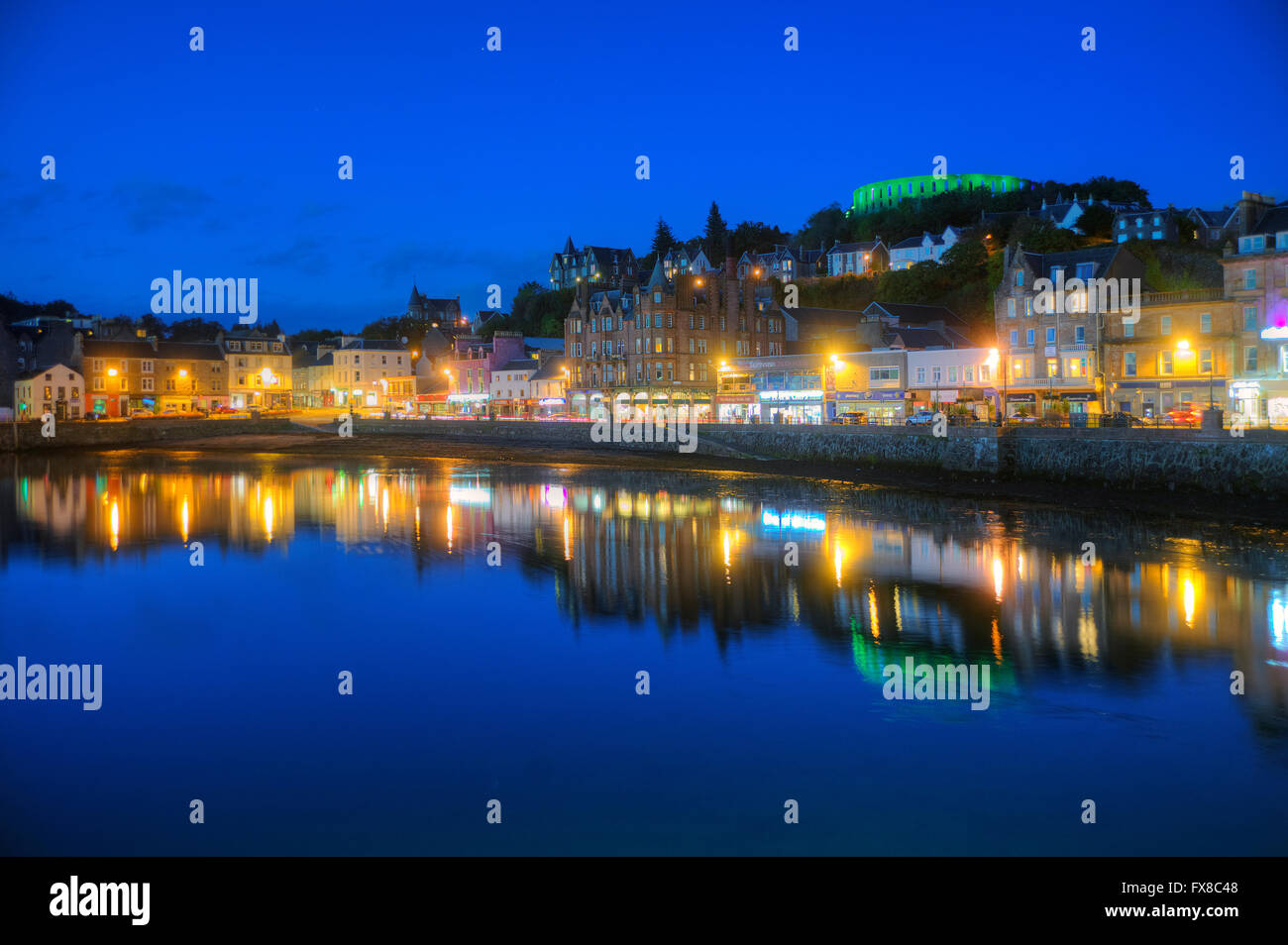 Dusk view of Oban with McCaigs Tower in view, Argyll Stock Photo