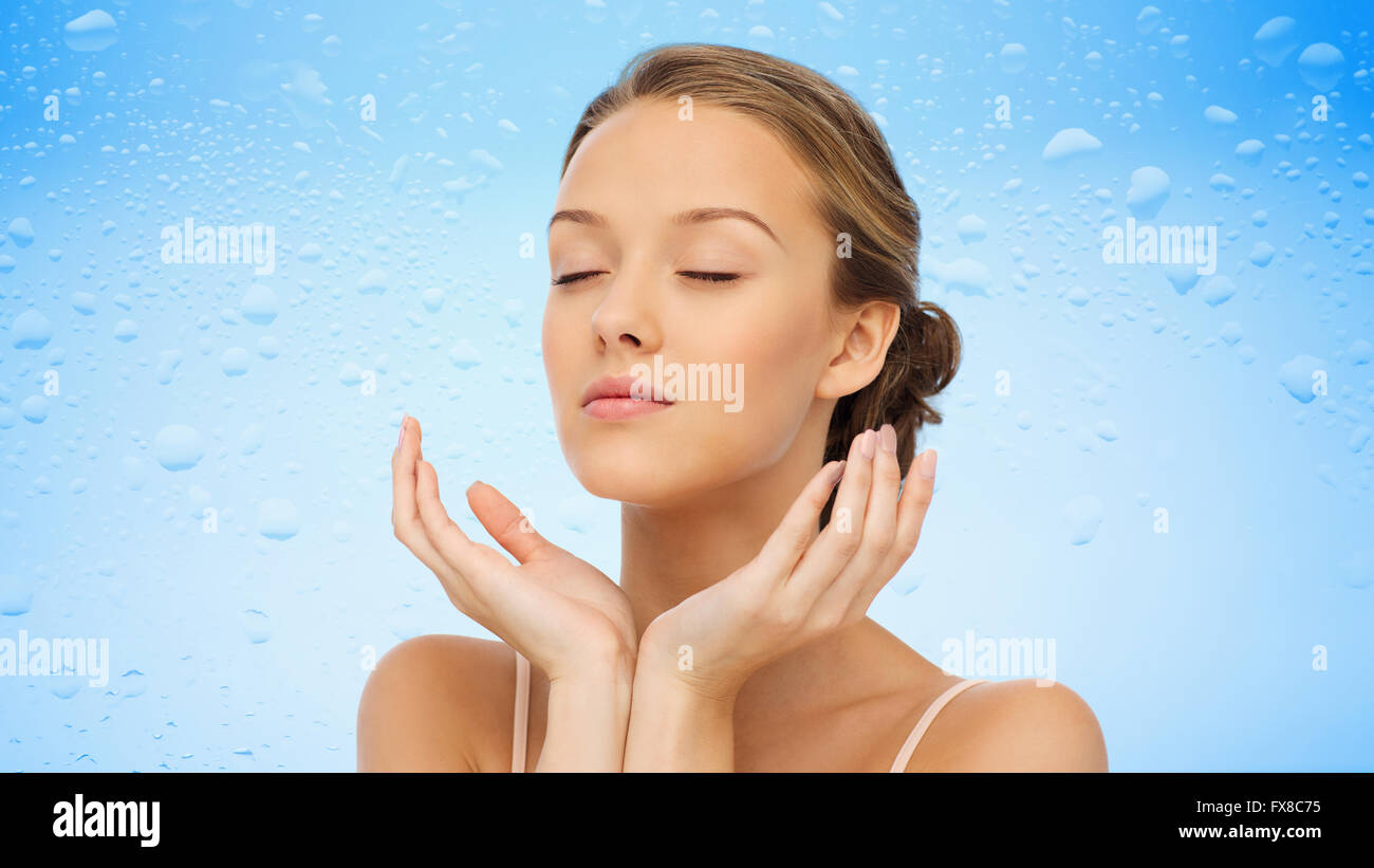 young woman face and hands Stock Photo - Alamy