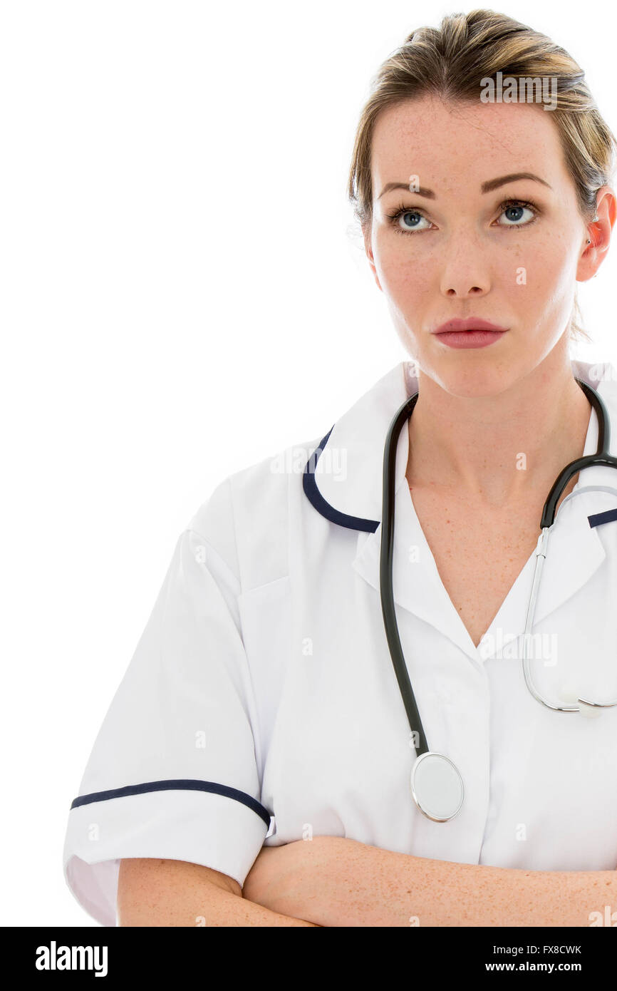 Thoughtful Female Doctor With A Stethoscope Isolated Against A White Background With Her Arms Folded Stock Photo