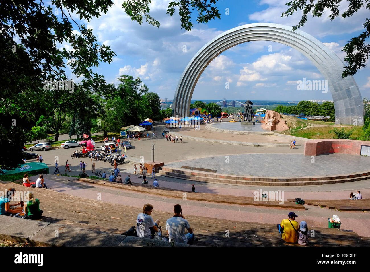 Locals and tourists in Kiev relax near the friendship of Nations Arch dedicated to the unification of Russia and Ukraine Stock Photo
