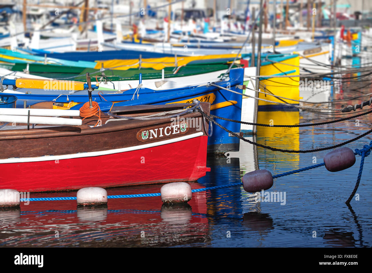 Nice Harbour - Showing small colourful  fishing boats in the harbour - Cote D Azure - France Stock Photo