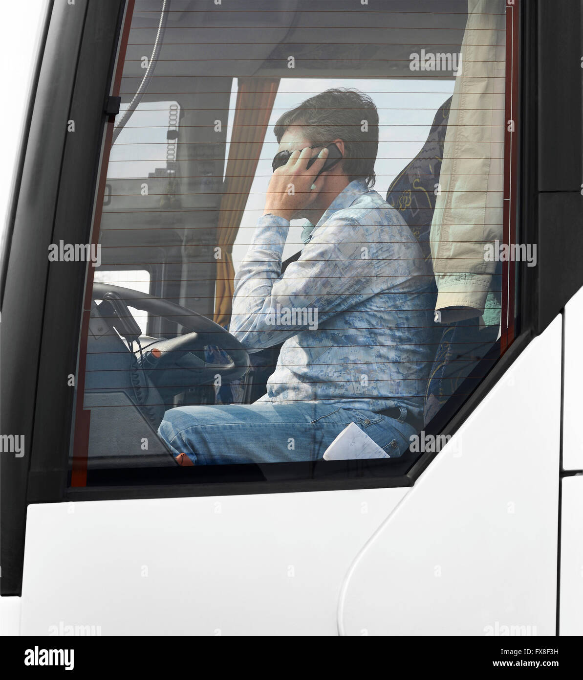 phone talking bus driver Stock Photo