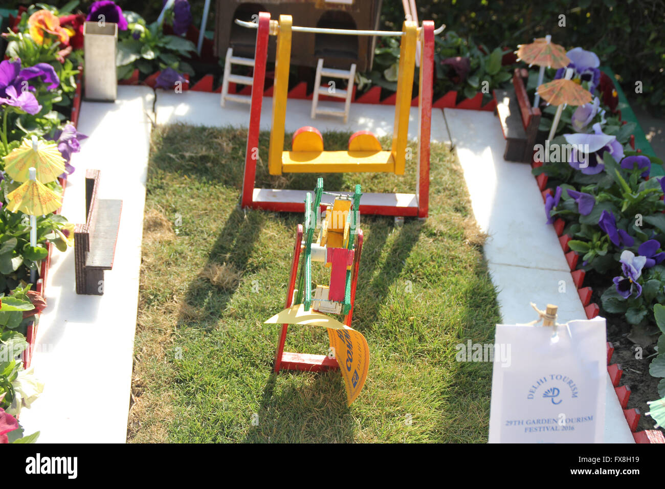Mini garden on a cart displayed at Garden Festival, complete with lawn