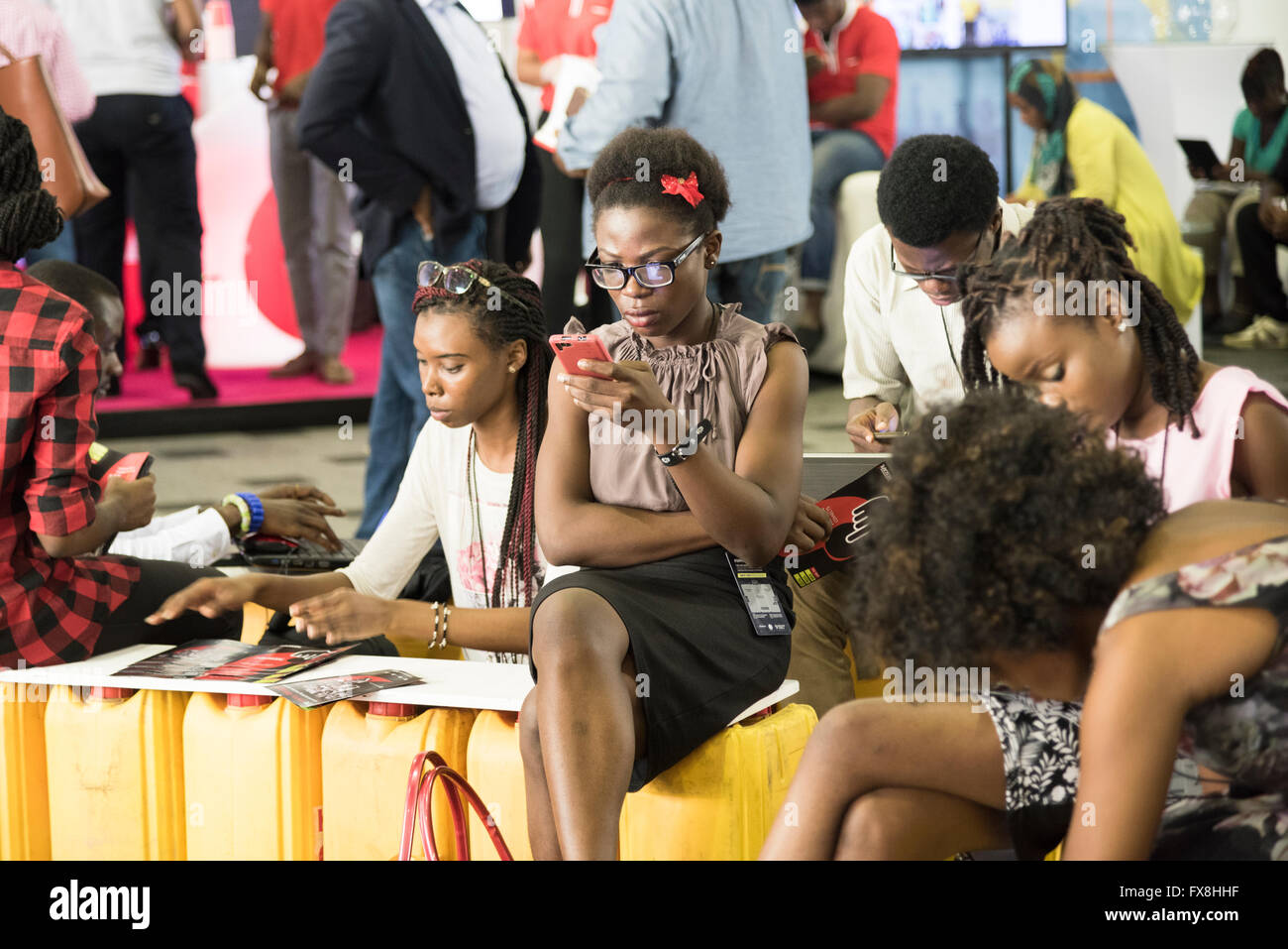 Young Nigerian woman using technology at Social Media Week conference. Stock Photo