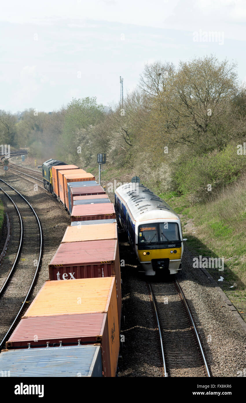 Freight and passenger trains passing in opposite direction
