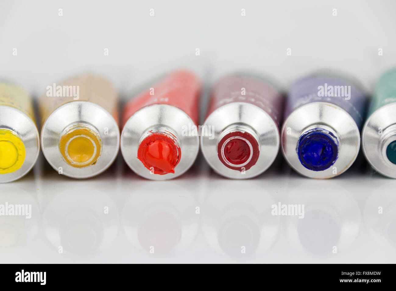 many color paint tubes macro on white background Stock Photo