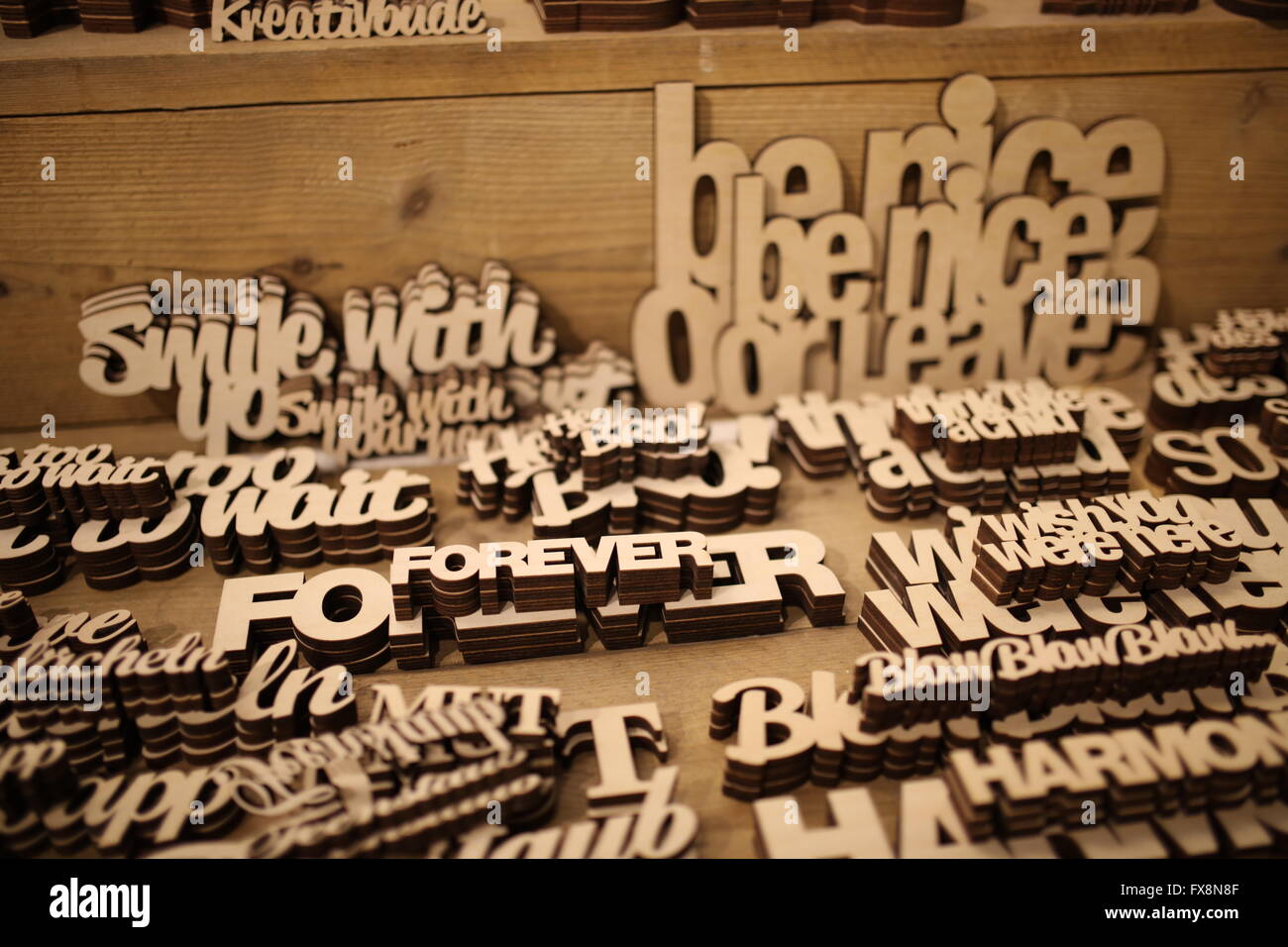 Writing carved out of wood in selective focus Stock Photo