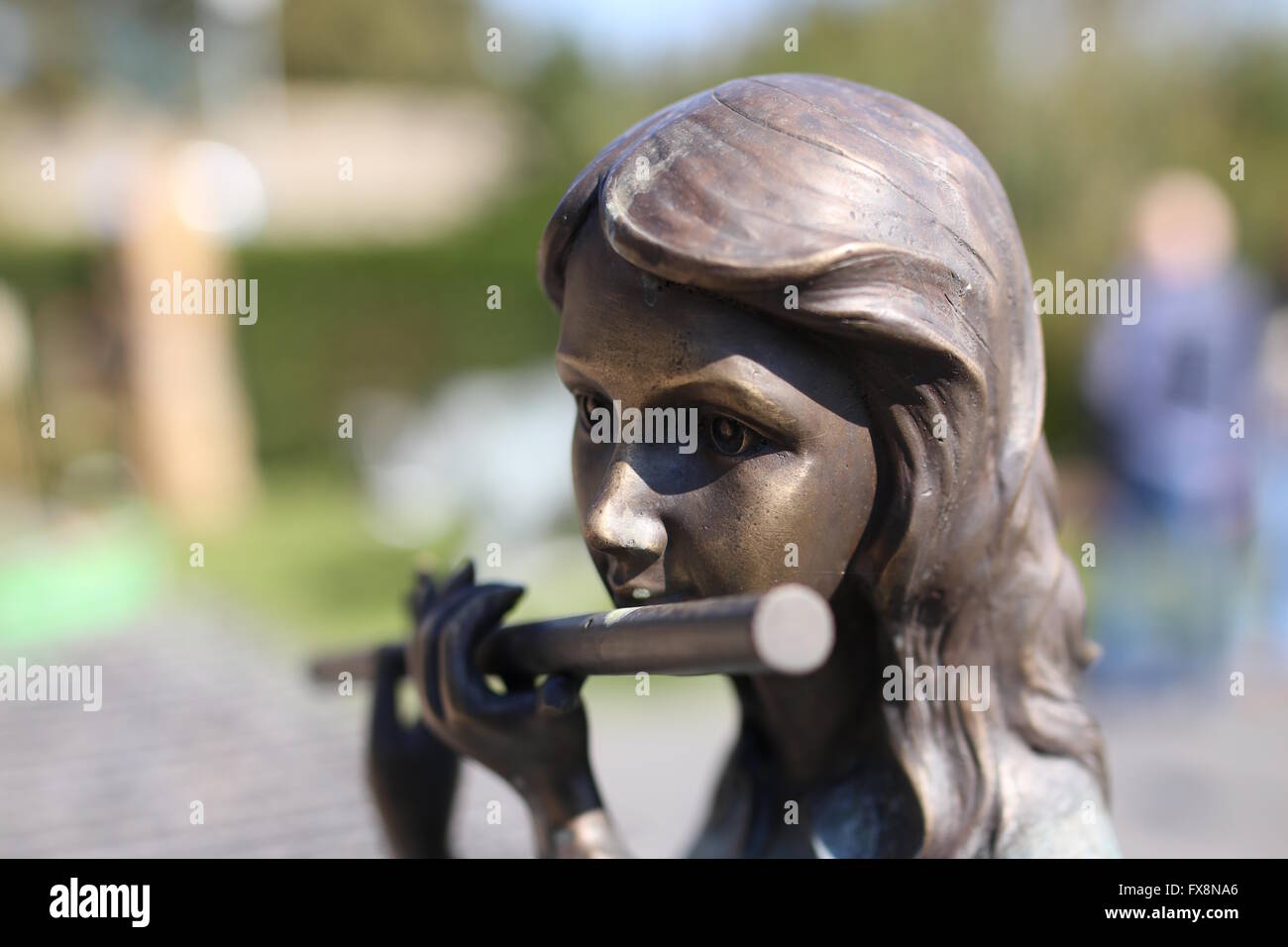 Figurine with german (transverse) flute Stock Photo Alamy