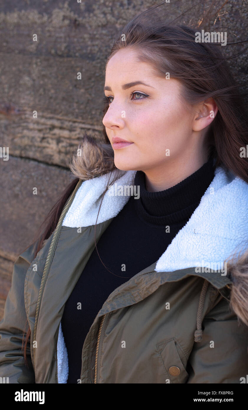 Woman leaning against a fence hi-res stock photography and images - Alamy