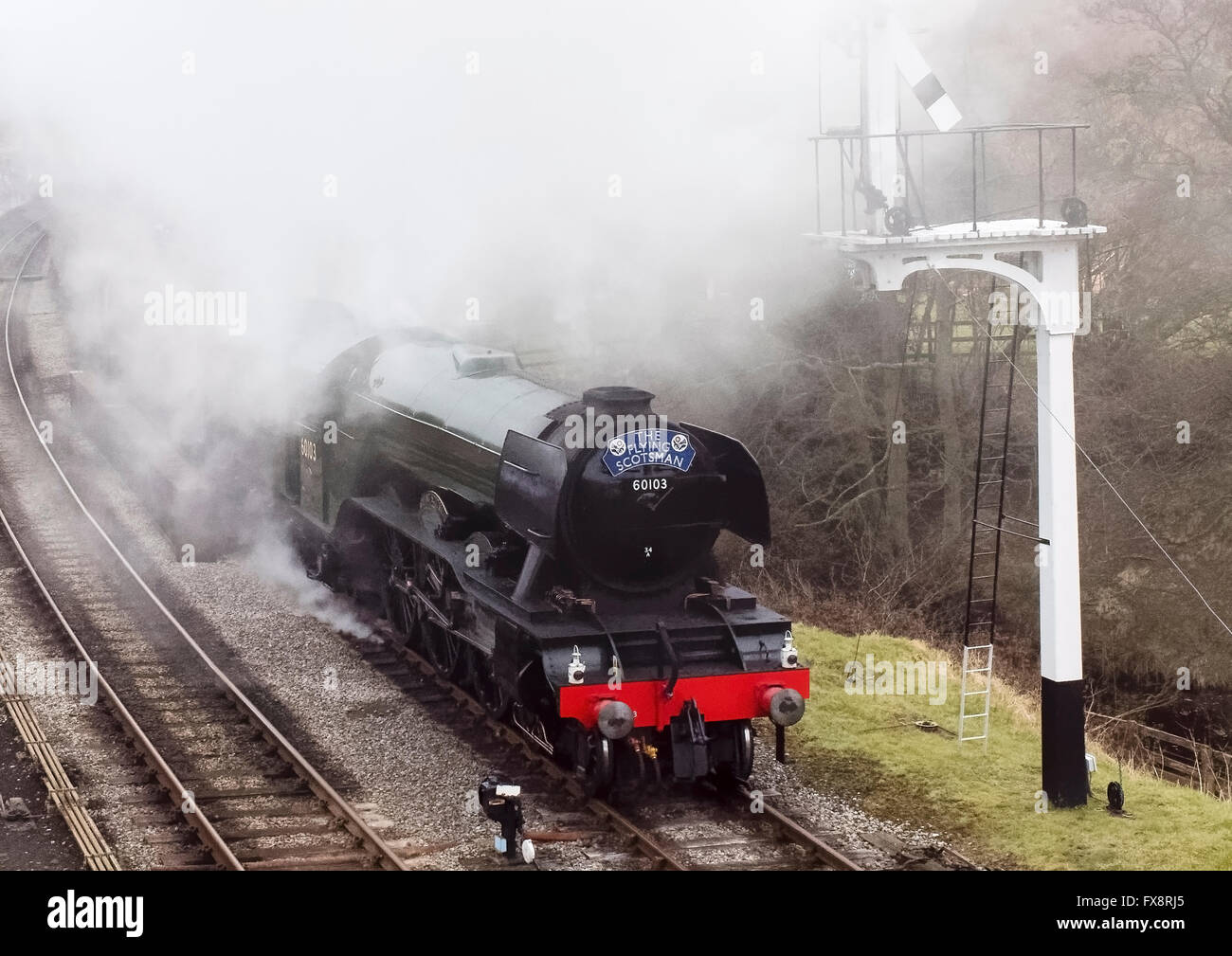 The Gresley 4-6-2 Pacific steam locomotive 60103 Flying Scotsman engulfed in a cloud of fog and steam at Goathland station Stock Photo