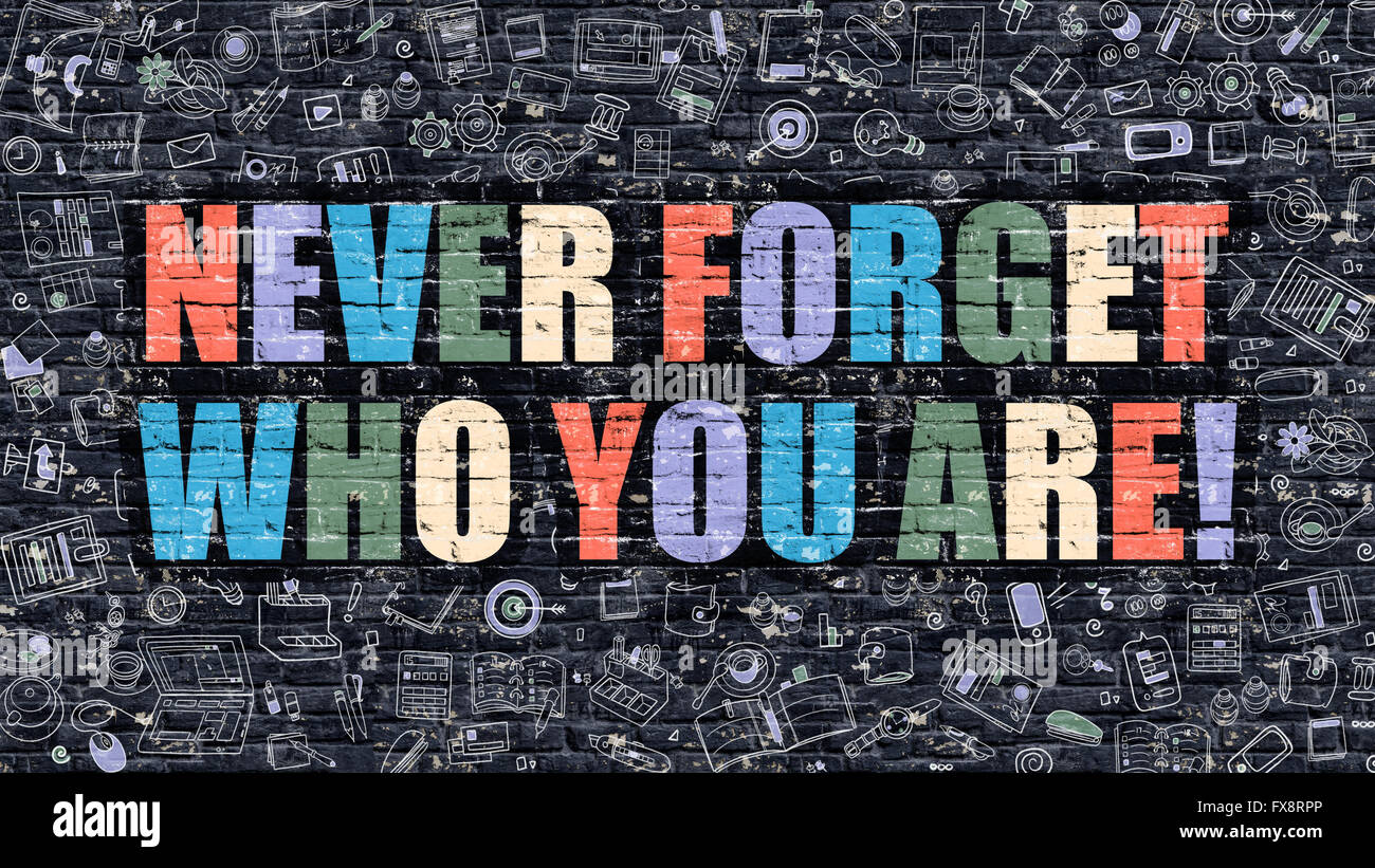 Never Forget Who You Are. Multicolor on Dark Brickwall. Stock Photo