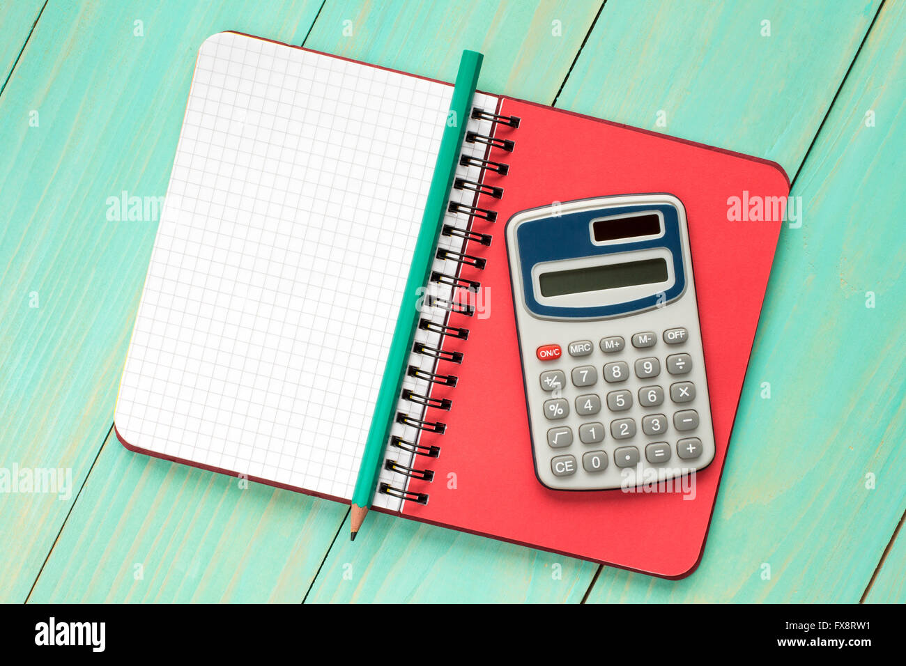 Electronic calculator and notebook with squared sheet for copy-space Stock Photo