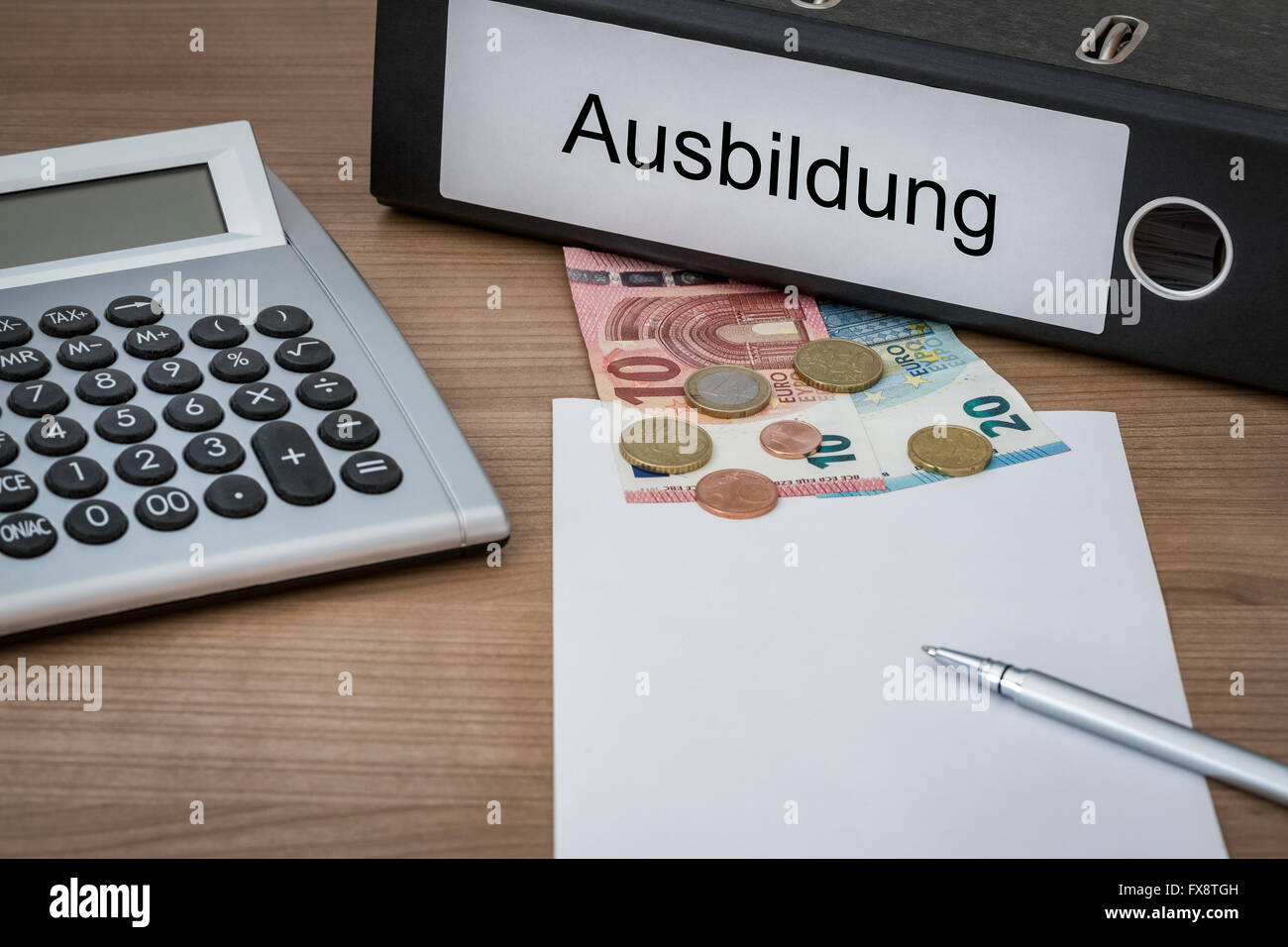 Ausbildung (German education) written on a binder on a desk with euro money calculator blank sheet and pen Stock Photo