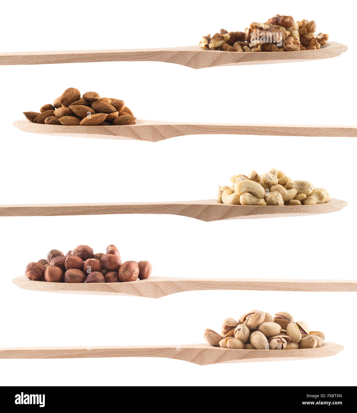 Wooden spoons full of different nuts Stock Photo Alamy