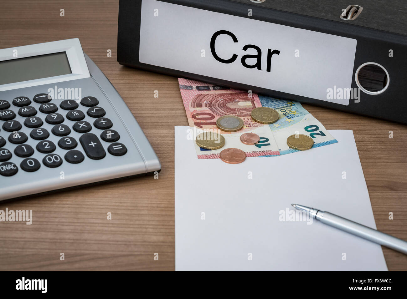 Car written on a binder on a desk with euro money calculator blank sheet and pen Stock Photo