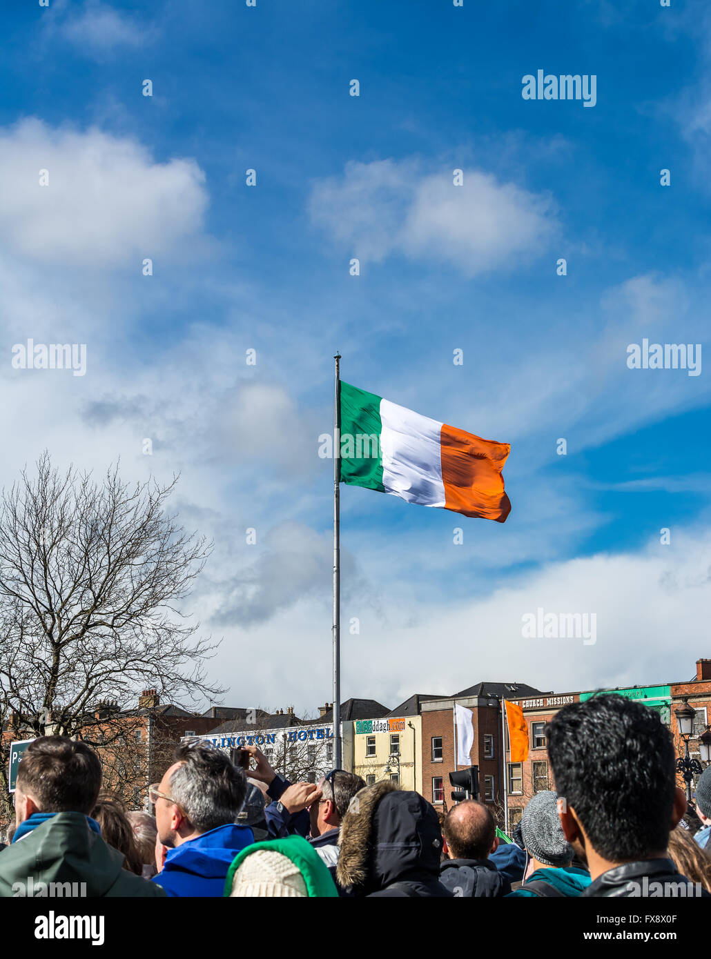 The Irish tricolour flag flies from pole in Dublin City Centre during