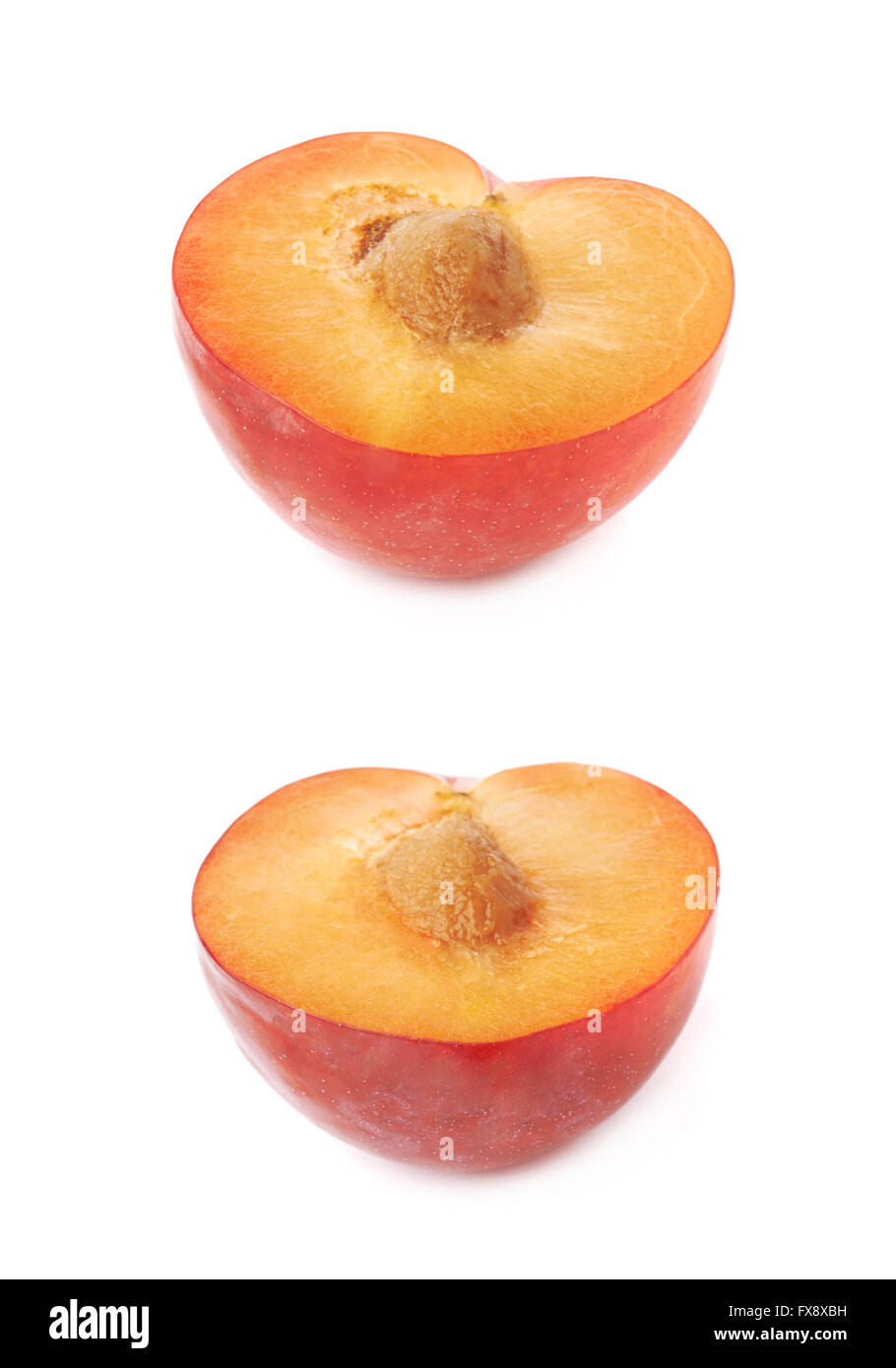Cut open plum half isolated Stock Photo Alamy