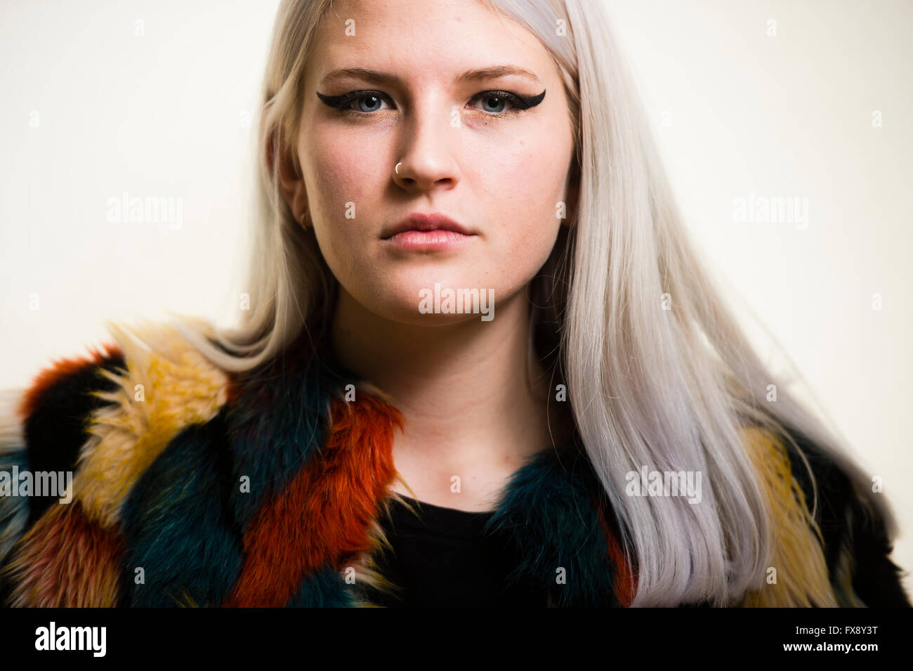 A Young Platinum Blonde Woman Girl Facing Ahead With Dramatic Eye
