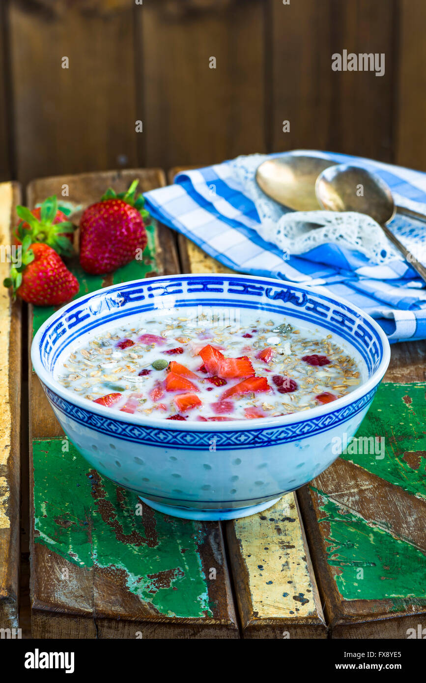 Porridge with milk, pumpkin and fresh fruit Stock Photo