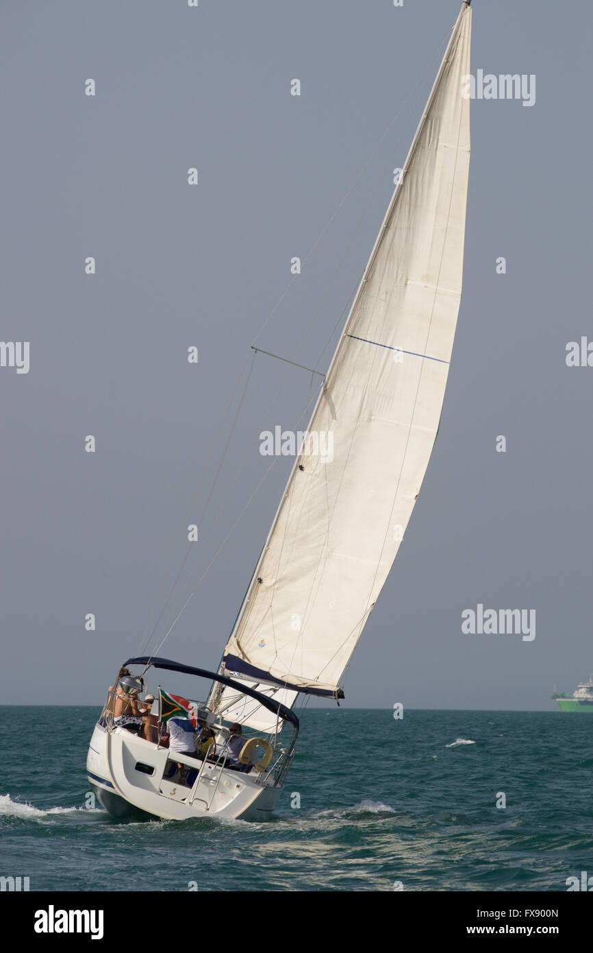 Sailboat heads out to sea with sails full Stock Photo - Alamy
