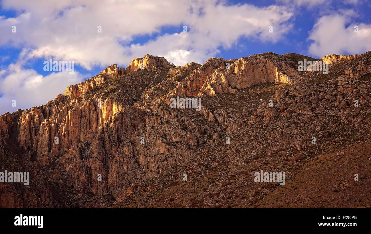 Clouds pass over the mountain peaks at Guadalupe Mountains National Park Stock Photo