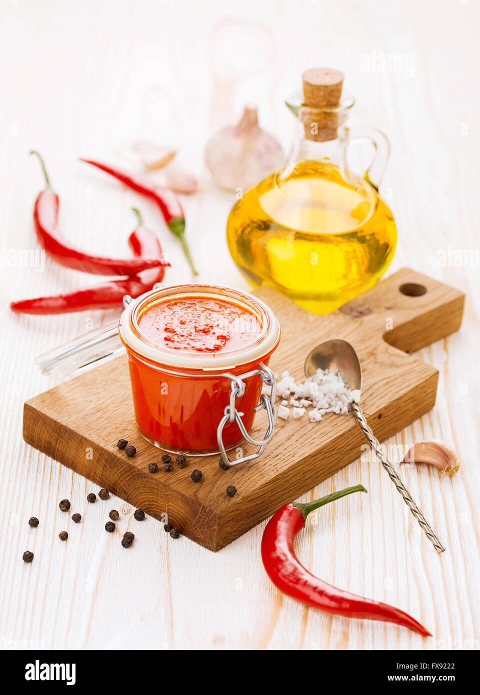 Jar of piquant sauce made from chili peppers and garlic Stock Photo