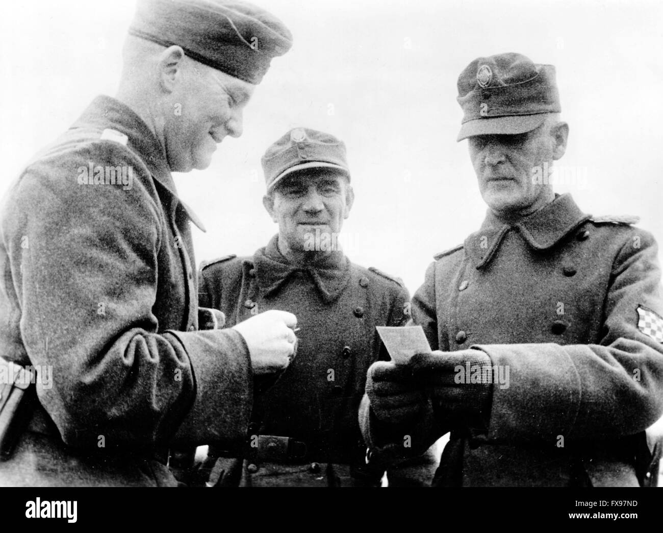 The Nazi propaganda image depicts the commander of a Croatian Legion (R with arm badge) talking to officers of the German Wehrmacht. The photo was taken in January 1942. Location unknown. Fotoarchiv für Zeitgeschichtee - NO WIRE SERVICE - Stock Photo