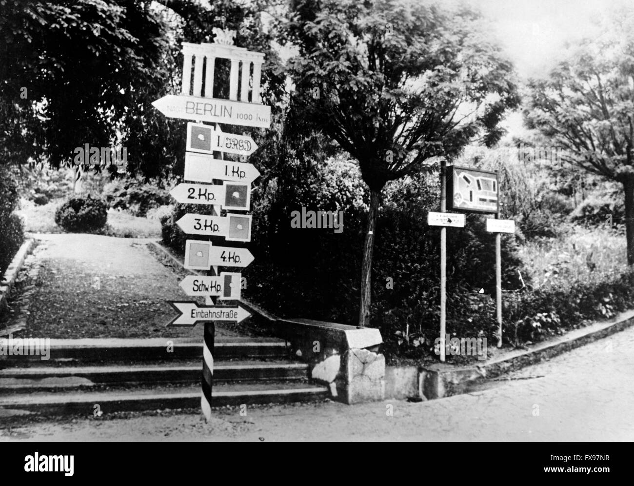 The Nazi propaganda image depicts a signpost in Yugoslavia with the inscription 'Berlin 1000 km' underneath an image of the Brandenburger Tor (Brandenburg Gate). The photo was published in May 1941. Fotoarchiv für Zeitgeschichtee - NO WIRE SERVICE - Stock Photo