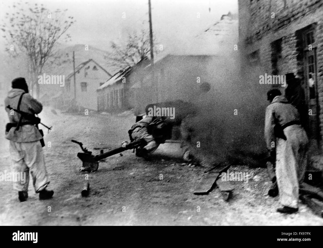 The Nazi propaganda image depicts soldiers of the German Wehrmacht at an anti-tank gun during the partisan combat in Yugoslavia. The photo was published in January 1944. Since summer 1942, the term 'partisan' had been prohibited by the Germans and replaced by 'Banden' (gangs), 'Banditen' (bandits), and 'Bandenbekaempfung' (fighting gangs). Fotoarchiv für Zeitgeschichtee - NO WIRE SERVICE - Stock Photo