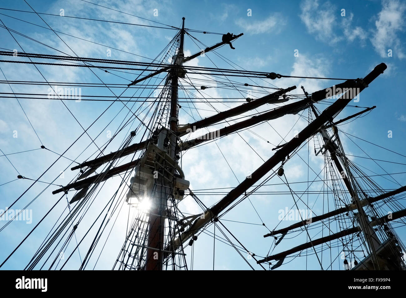 Bristol Docks, UK. 12th april 2016.  A crew member works at  the top of a mast on the Kaskelot, all tall ship moored in Bristol Harbour. The magnificent square rigged sailing vessel is back in her home port during March, April and May Credit:  Stephen Hyde/Alamy Live News Stock Photo